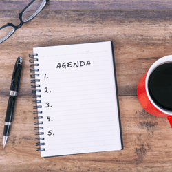 agenda with coffee cup